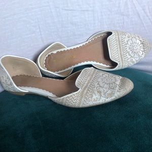 Restricted white “lace” flat